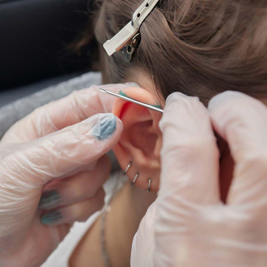 illustrated straight barbell with glowing end balls to indicate pain