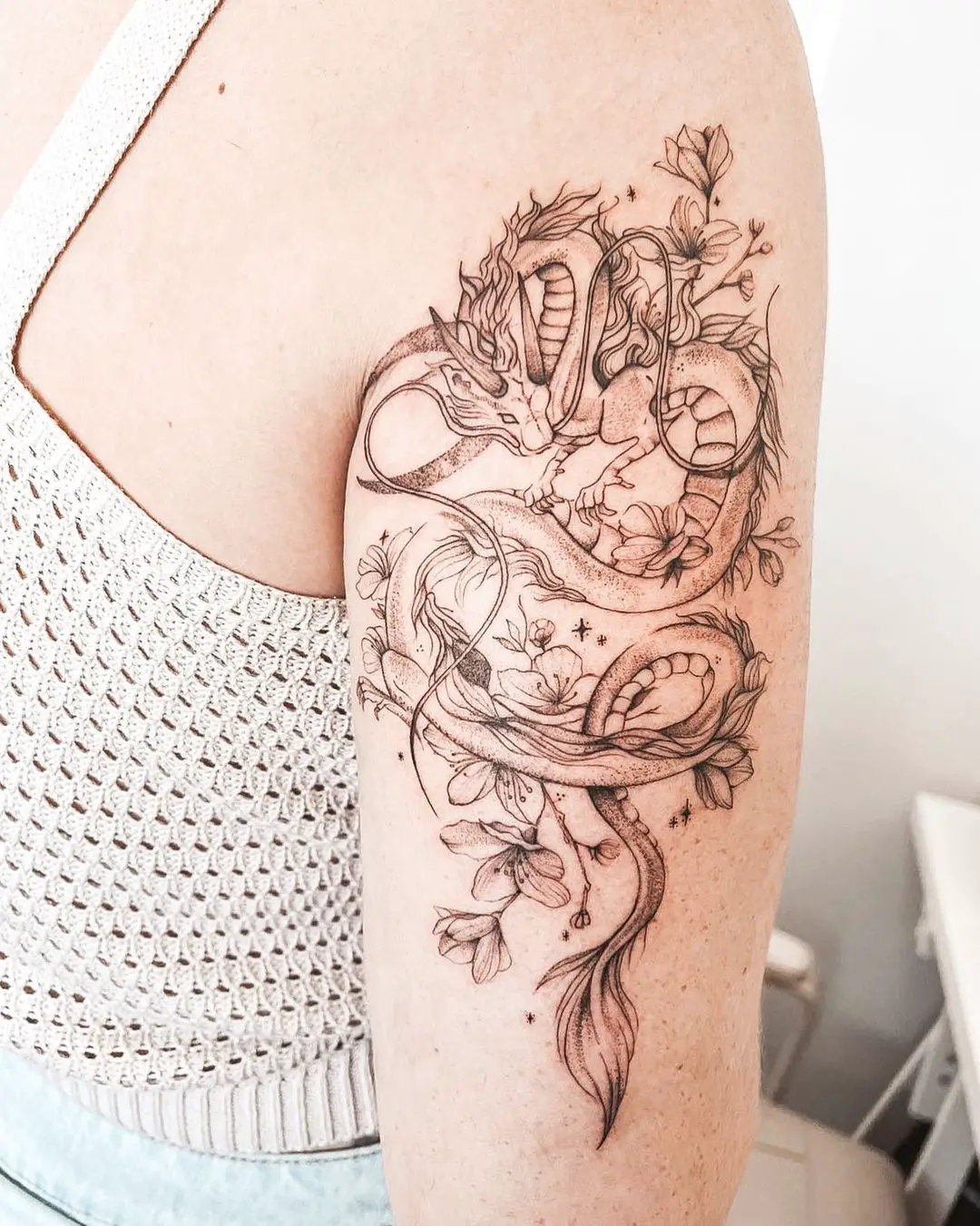 Floral dragon tattoo by xanadenruyter.tattoo